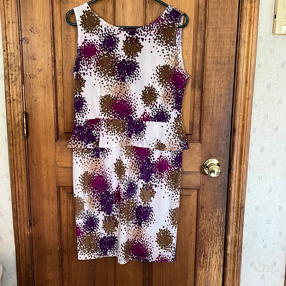 Size 12 peplum dress. Has some stretch as it is 95% polyester 5% spandex